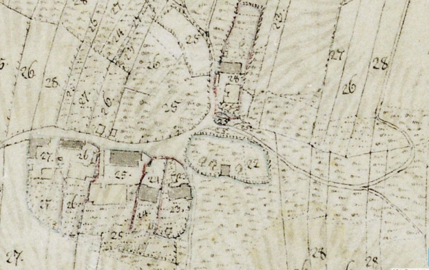 Detailiertes altes Stadtplanbild mit Gebäuden, Straßen und Text, das eine vorgeschlagene Entwicklungsstelle am unteren Rand zeigt.