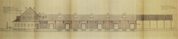 Schwarz-weißes Architekturzeichnung eines mehrfenstrigen Schulgebäudes auf Papier mit begleitendem Text.