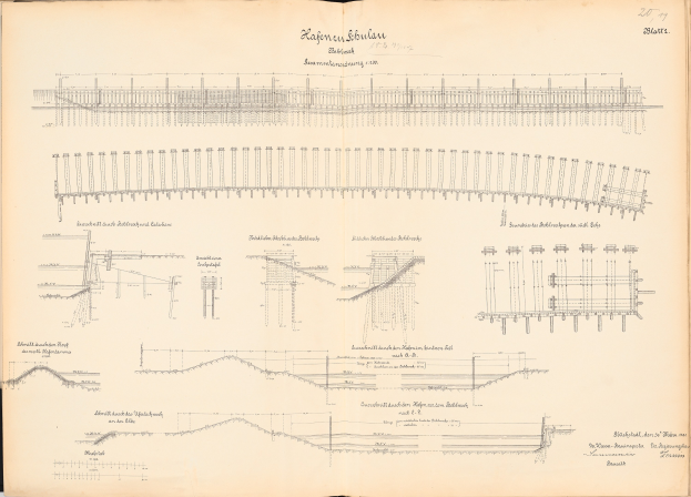 Offenes Buch mit detaillierten Zeichnungen und Text eines Eisenbahnsystems, einschließlich einer Eisenbahnschienen-Illustration.