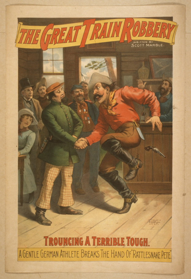 Eine Gruppe von Menschen drinnen, einer hält eine Waffe, mit Text oben und unten: "Der große Zugraub - Trouching ein schrecklicher Tough".