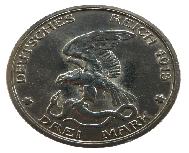 Silbermünze mit einem Adler, der eine Schlange umklammert, Flügel weit gespreizt, Text 'Deutsches Reich' auf weißem Hintergrund.